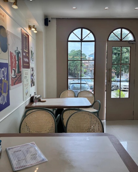 Genuine Kaaafi Korner café atmosphere with arched French windows and cozy seating
