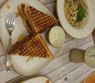 Genuine toasted vegetable grilled sandwich with crisp grill marks and dip served at Kaaafi Korner
