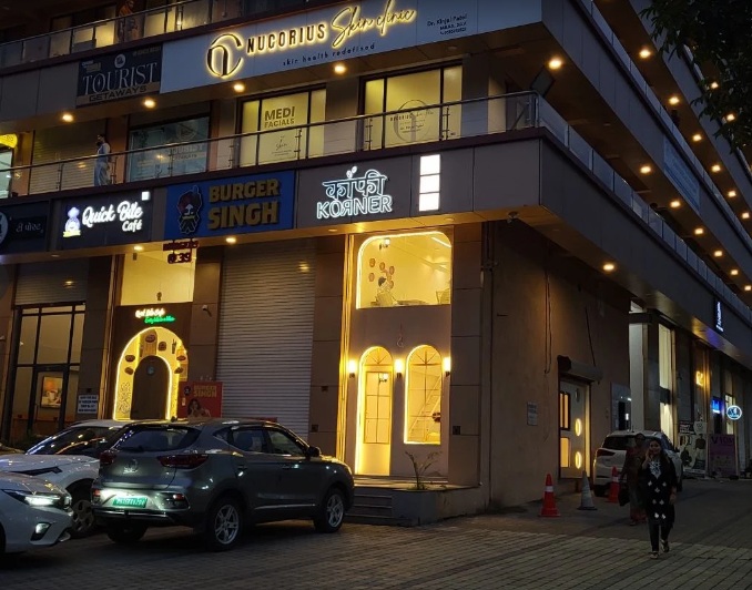 Actual Kaaafi Korner storefront with illuminated sign and warm entrance at Horizon Park, Silvassa